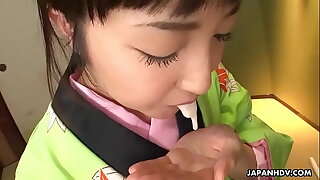 Asian pro in a kimono sucking on his erect prick